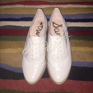 Women's Sam Edelman white wingtip flat oxfords.